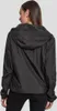 A woman wearing a black windbreaker jacket. Produktbild-Vorschau