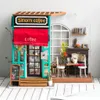 A miniature diorama of a coffee shop called Simon's Coffee. Anteprima dell’immagine prodotto