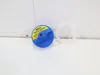 A blue and yellow water tank cap with a white ring next to it, placed on a white surface with a light gray background. Voir les images du produit