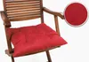 A red cushion on a wooden chair. Produktbild-Vorschau