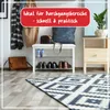 An entryway with a shoe rack, bench, bags, and a rug. Produktbild-Vorschau