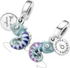 Two Pandora charms shaped like chameleons, each with a small circular tag attached. Anteprima dell’immagine prodotto