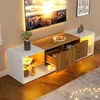 A modern TV stand with integrated LED lighting and a television mounted above it. Voir les images du produit