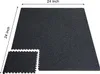 A black interlocking floor mat is shown from a slightly elevated angle. Voir les images du produit