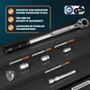 A torque wrench set with various attachments displayed on a dark, tiered surface. Produktbild-Vorschau