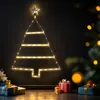 A decorative Christmas tree made of lights and a star topper hangs on a dark wall, with wrapped gifts on the floor below and a blurred Christmas tree in the background. Voir les images du produit