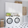 A modern laundry room with two front-loading washing machines, white cabinets above, and baskets on top. A wooden drying rack is mounted on the wall. Anteprima dell’immagine prodotto