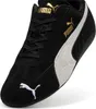 A black Puma Speedcat OG sneaker with white accents and gold branding. Voir les images du produit