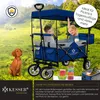 A family wagon with two children and a dog in a grassy outdoor setting. Produktbild-Vorschau