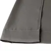 A close-up view of the bottom hem of a gray curtain, showing the stitching and a side slit. Produktbild-Vorschau