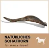 A dog chew toy made from a sheep horn is shown against a white background, with text and a dog silhouette in the lower section. Produktbild-Vorschau