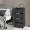 A bedroom scene with a bed and a storage dresser next to it. Podgląd zdjęcia produktu