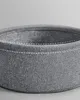 Close-up of a grey fabric basket with white stitching. Náhled obrázku produktu