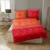 A bed with bedding and pillows in a bedroom setting. Produktbild-Vorschau