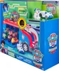 The image shows the retail packaging of a Paw Patrol Mission Cruiser toy set. The packaging is designed to display the product inside, with cutouts and clear plastic windows. Various Paw Patrol characters and vehicles are visible within the packaging. Produktbild-Vorschau