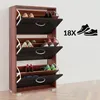 A wooden shoe cabinet with three flip-down drawers, filled with various shoes. Produktbild-Vorschau