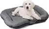 A white puppy lies on a gray dog bed. Produktbild-Vorschau