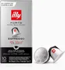 A box of illy Forte Espresso capsules and two loose capsules. Produktbild-Vorschau