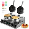 A commercial double-headed waffle maker with accessories and a finished waffle on a plate. Náhled obrázku produktu