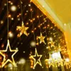A string of star-shaped lights hanging indoors, likely as decoration. Produktbild-Vorschau