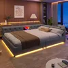 A modern bedroom with a large, upholstered bed featuring ambient lighting. Produktbild-Vorschau