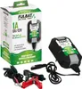 A product box and its contents, including a battery charger, cables, and clips, are displayed against a white background. Náhľad obrázku produktu