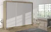 A sliding door wardrobe is shown in a room with a large window and a sofa. Náhľad obrázku produktu