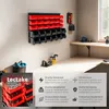 A workshop or garage setting with a wall-mounted storage system filled with red and black bins, and a workbench. Produktbild-Vorschau