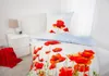 A bed with a duvet cover and pillow featuring a poppy flower print. Produktbild-Vorschau
