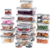 A collection of clear plastic food storage containers with gray lids, filled with various food items, arranged in stacks. Produktbild-Vorschau