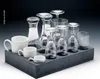 A set of glassware and mugs arranged on a dark gray tray. Podgląd zdjęcia produktu