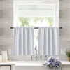 A kitchen sink area with white bistro curtains hanging over a window. Náhled obrázku produktu
