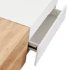 A close-up view of a white and wood-grain drawer of a table, with the drawer partially open. Náhľad obrázku produktu