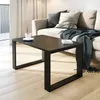 A modern living room scene with a couch and coffee table. Voir les images du produit