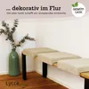 A bench with cushions in a hallway setting, next to a vase with dried flowers. Náhled obrázku produktu
