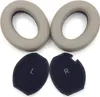 Two pairs of ear pads for headphones, one pair gray and one pair black. Náhľad obrázku produktu