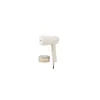 A white handheld garment steamer and a small transparent container. Produktbild-Vorschau