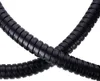 Two black flexible hoses are intertwined against a white background. Náhľad obrázku produktu