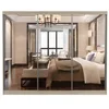 A bedroom scene reflected in mirrored closet doors. Voir les images du produit