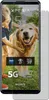 A smartphone screen displaying a picture of a child and a dog, with various camera feature icons and text overlays. Anteprima dell’immagine prodotto