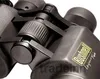 A close-up view of a black Bushnell Legacy binoculars, focusing on the central adjustment mechanism and the brand logo. Produktbild-Vorschau