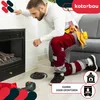 A man is kneeling next to a fireplace, appearing to be working on it. Tools and materials are scattered on the floor. Podgląd zdjęcia produktu