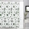 A white shower curtain with a green leaf pattern is hanging in a bathroom. Produktbild-Vorschau