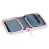 An open pink pencil case with a gray insert and a small blue pouch inside. Anteprima dell’immagine prodotto