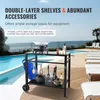 A black outdoor grill cart with various accessories is set up next to a swimming pool and lounge chairs. Produktbild-Vorschau