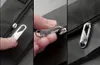 A collage of three close-up images showing a person's hand interacting with a zipper pull tab. Produktbild-Vorschau