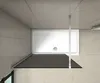 A top-down view of a shower enclosure with a white shower tray and a dark glass panel. Produktbild-Vorschau