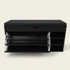 A black shoe cabinet with a padded seat on top, featuring pull-out shelves. Náhľad obrázku produktu