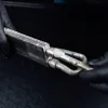 Hands wearing black gloves holding a metal heat exchanger. Anteprima dell’immagine prodotto