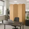 An office space with a desk, chair, and a room divider. Podgląd zdjęcia produktu